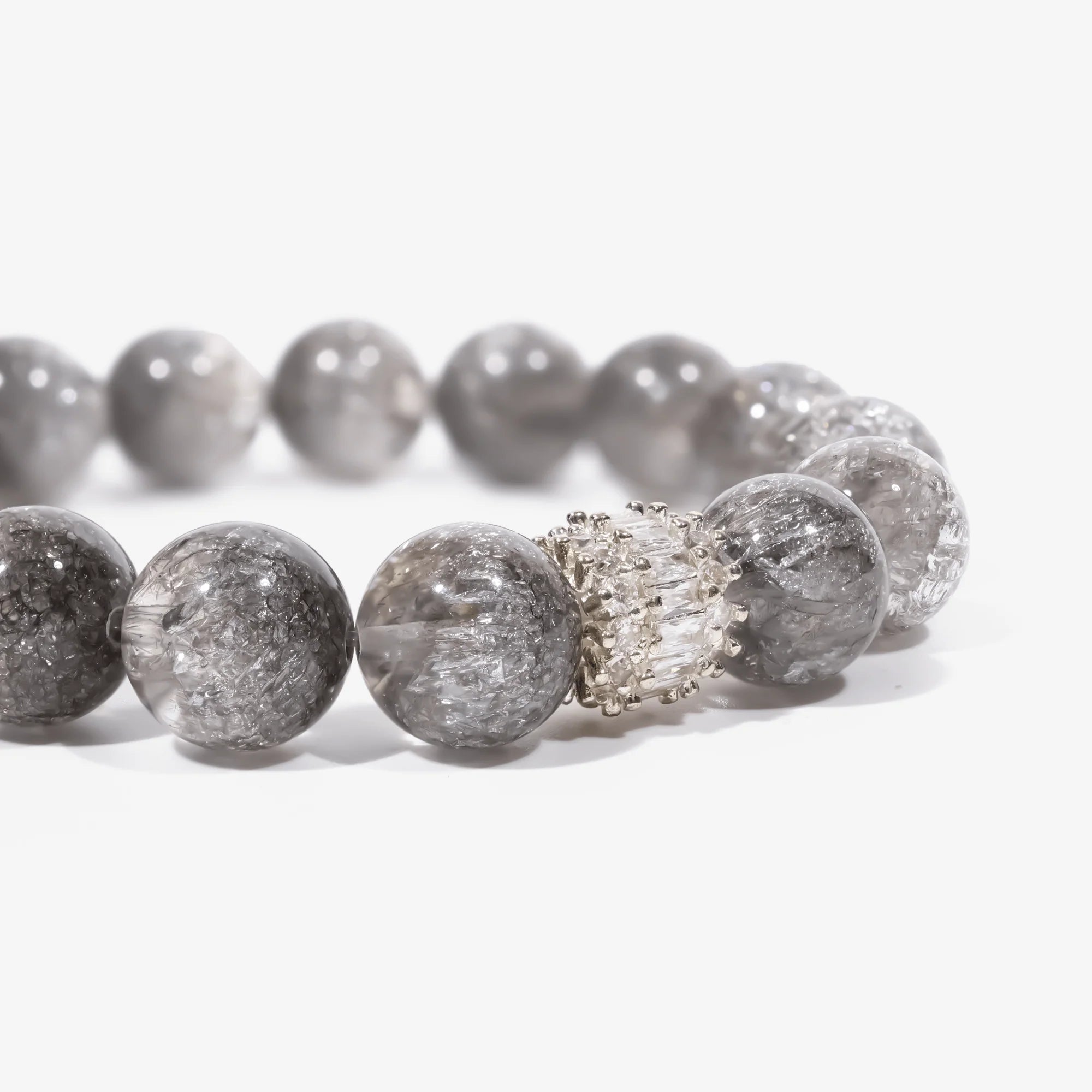 Cropped left-side half-view of the ethereal harmony clear crystal bracelet on a pure white background.
