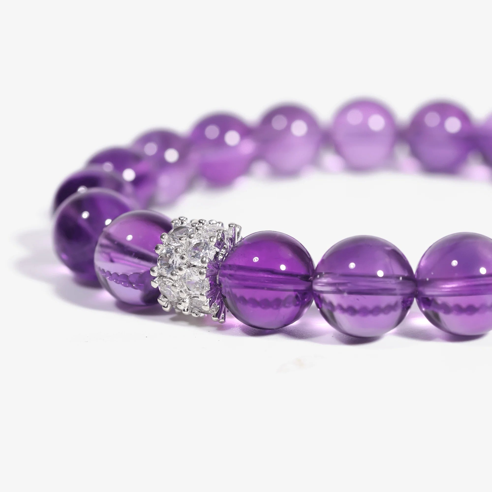 Cropped right-side half-view of the serene purple amethyst beaded bracelet on a pure white background.