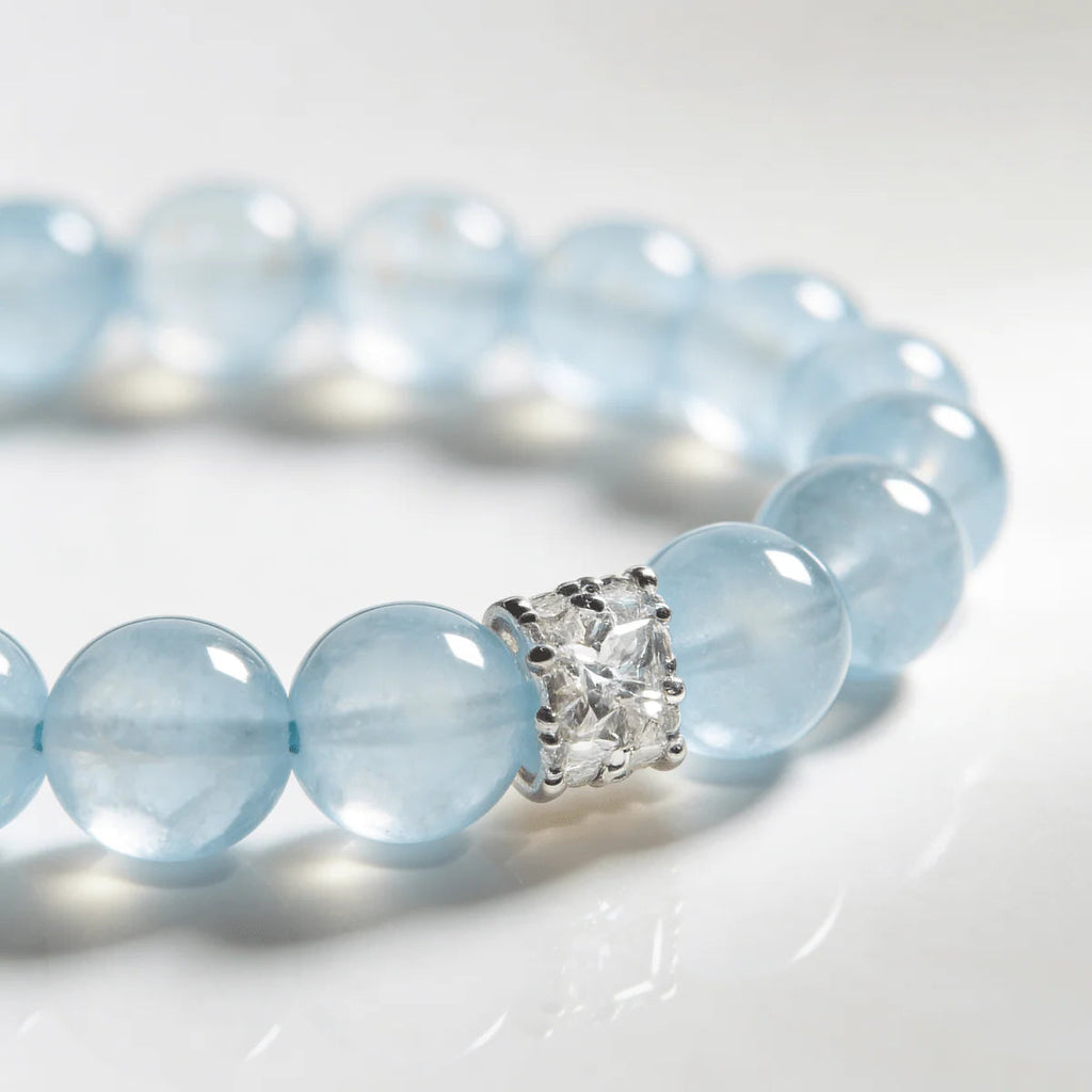 Cropped left-side half view of the coastal elegance blue aquamarine gemstone bracelet on a pure white background.