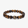 Studio product shot of Kailash Tiger's Eye Dzi Bracelet isolated on a clean white background.