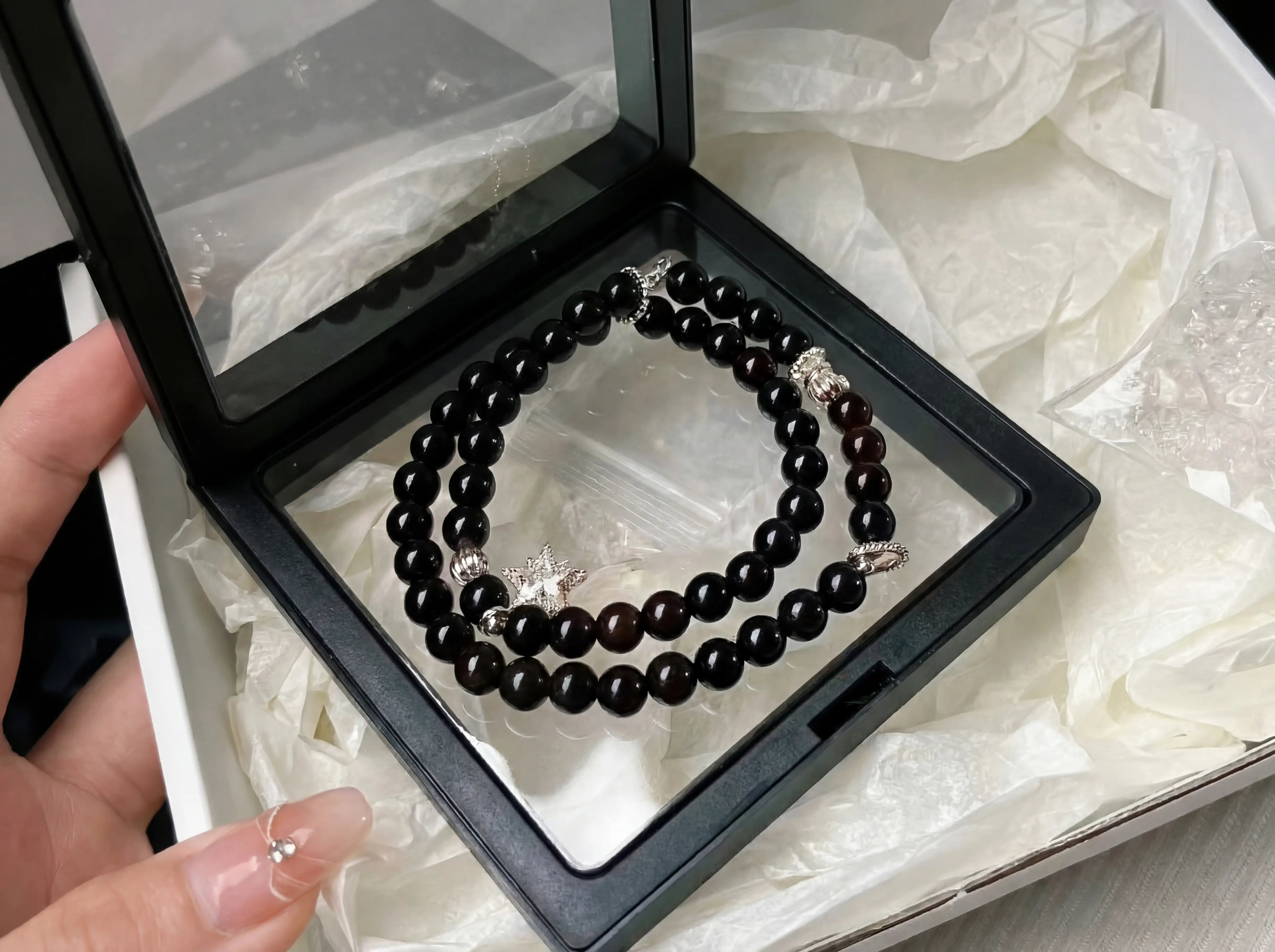 High-elasticity PE film anti-oxidation floating frame storage box for premium crystal protection.