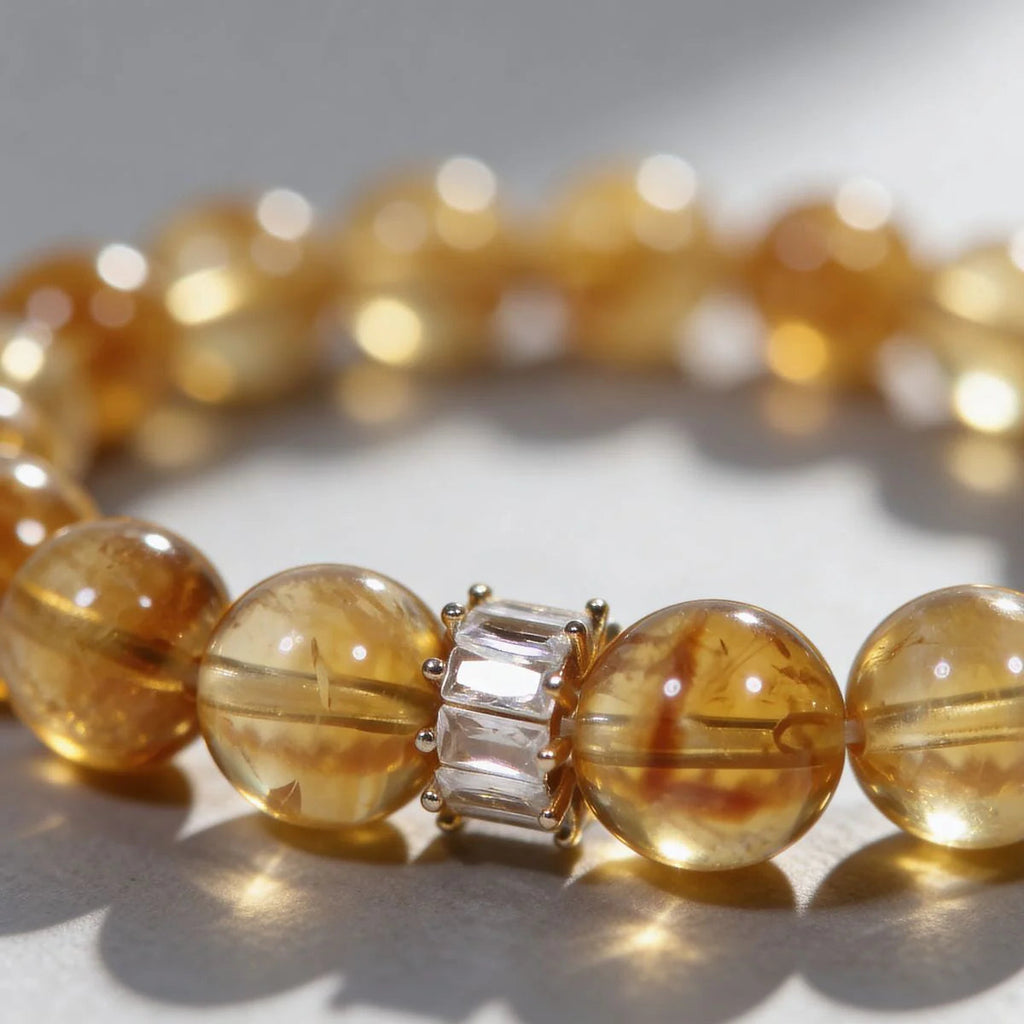 Centrally zoomed-in view of the radiant citrine crystal bracelet on a white background with cropped sides.