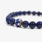 Cropped right-side half view of the premium blue lapis lazuli crystal bracelet on a pure white background.