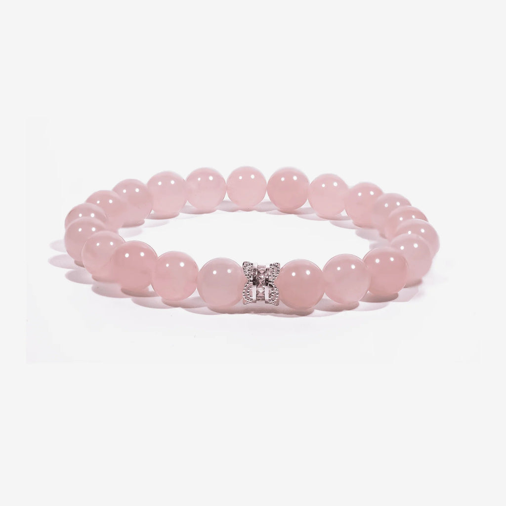 Studio product shot of Serenity Heart Rose Quartz Bracelet isolated on a clean white background.