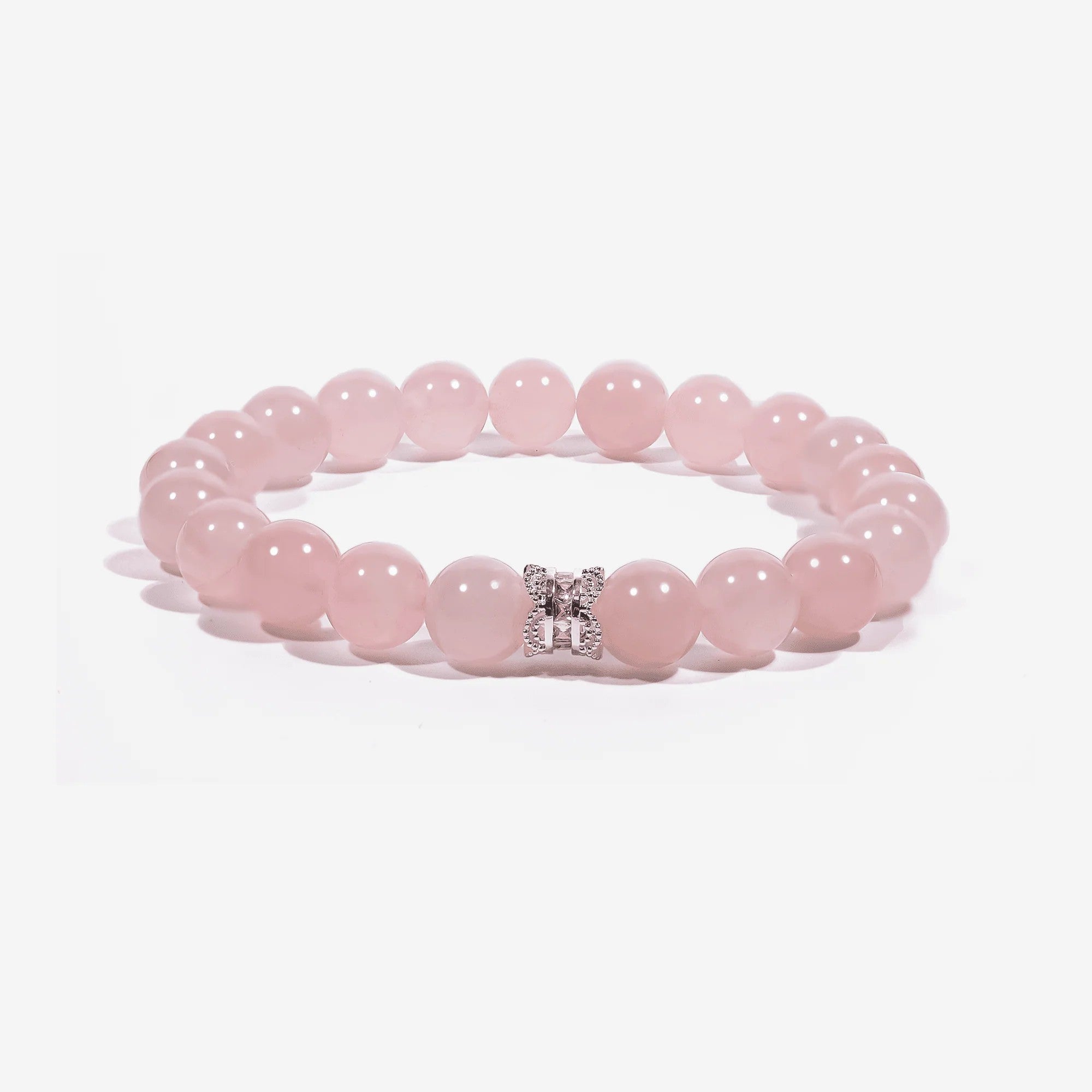 Studio product shot of Serenity Heart Rose Quartz Bracelet isolated on a clean white background.