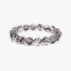 Studio product shot of Calm Armor Black Rutilated Quartz Bracelet isolated on a clean white background.