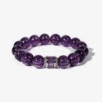Studio product shot of the graceful amethyst poise bracelet crystal showcasing deep purple gemstone beads and a silver accented centerpiece over white.