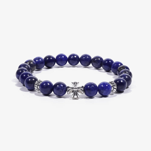 Studio product shot of Lucky Clarity Lapis Cross Bracelet isolated on a clean white background.