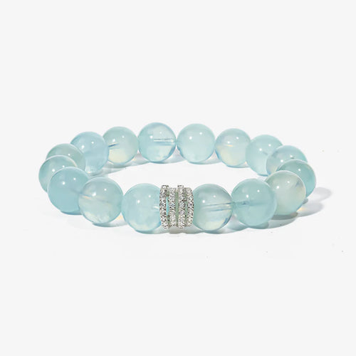 Studio product shot of Ocean Calm Aquamarine Bracelet with a customizable centerpiece isolated on white.