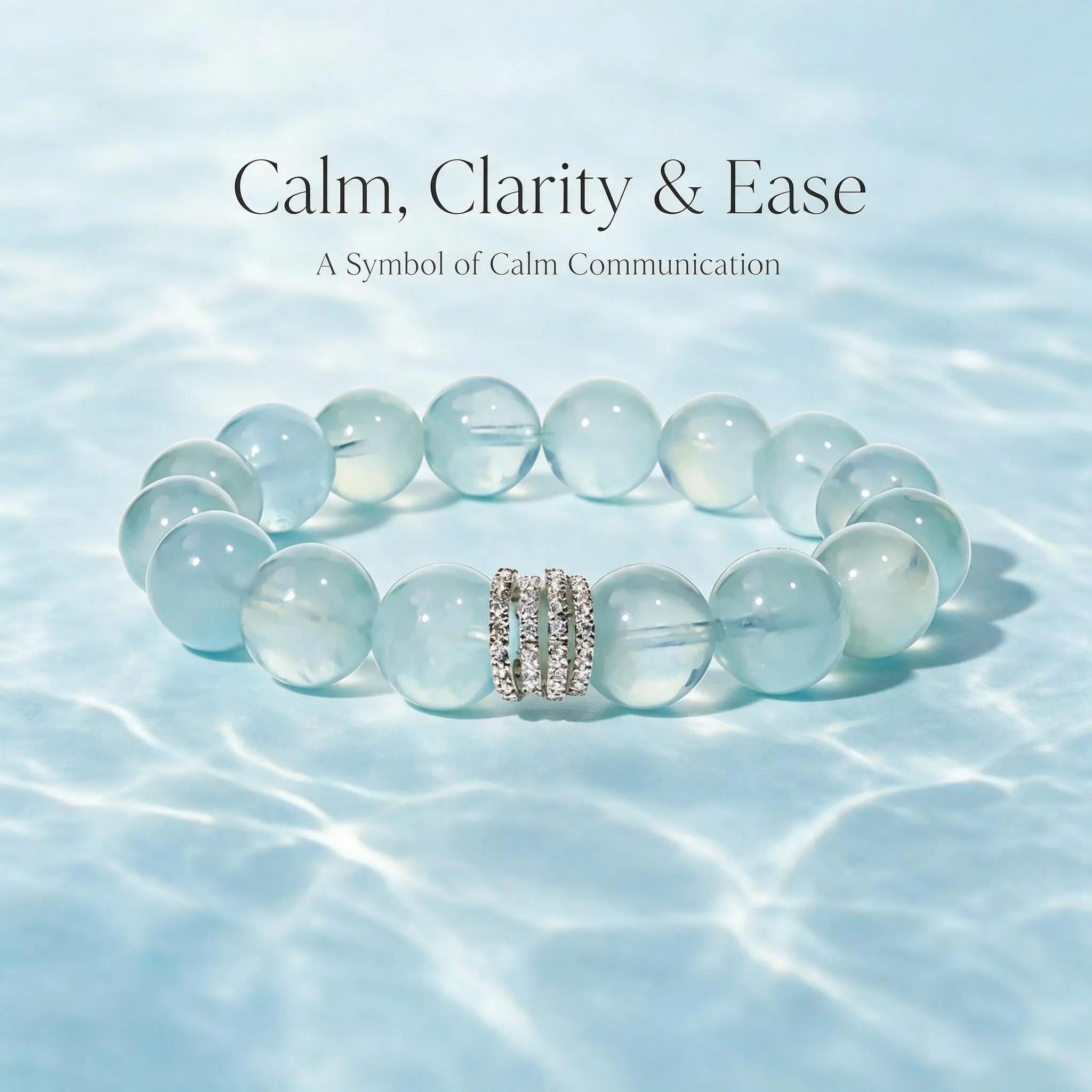 Front crop to the collarbone showing a woman clutching a hardcover book to her chest revealing her gemstone bracelet.